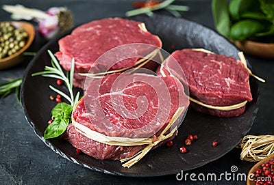 Raw organic beef steak with spices Stock Photo