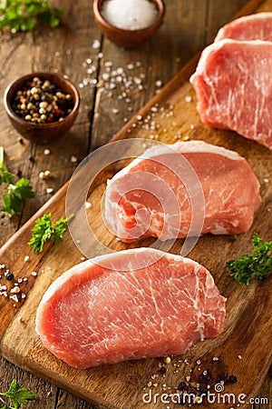 Raw Organic Boneless Pork Chops Stock Photo