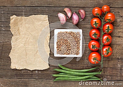 Raw Organic buckwheat, vegetables and paper Stock Photo