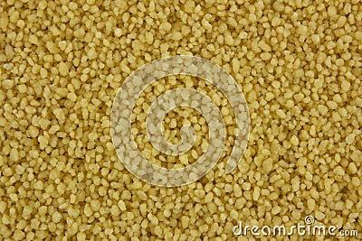 Raw organic couscous background Stock Photo