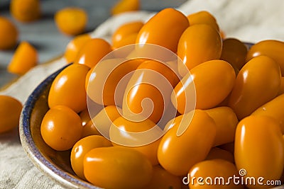 Raw Organic Orange Cherry Tomatoes Stock Photo