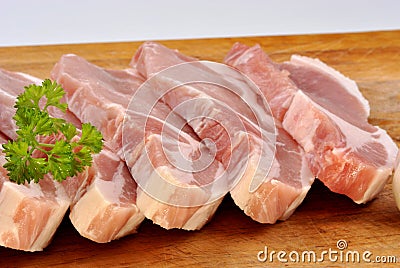 raw organic pork chop and parsley Stock Photo