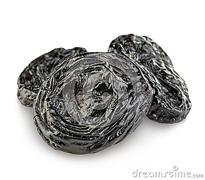 Raw organic prunes, dried plums, smoked prunes close-up on a white background. Stock Photo