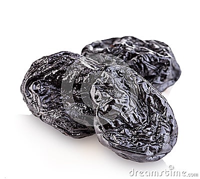Raw organic prunes, dried plums, smoked prunes close-up on a white background. Stock Photo