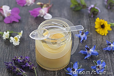 Raw organic royal jelly in a small bottle Stock Photo