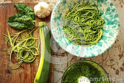 Raw pasta with zucchini and spinach pesto with garlic Stock Photo