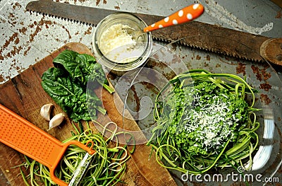 Raw pasta with zucchini and spinach pesto with garlic Stock Photo