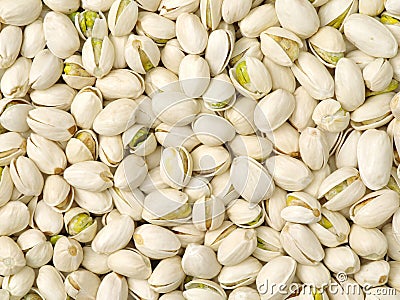 Raw pistachio nuts heap texture Stock Photo