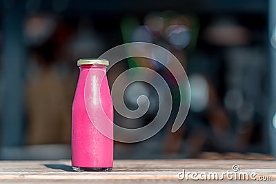 Raw pomegranate juice in glass bottle Stock Photo