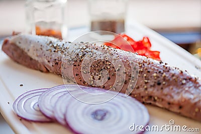 Raw pork fillet with freshly ground pepper Stock Photo