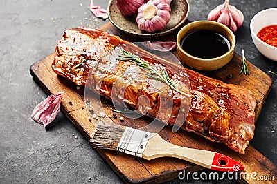 Raw pork ribs in a marinade Stock Photo