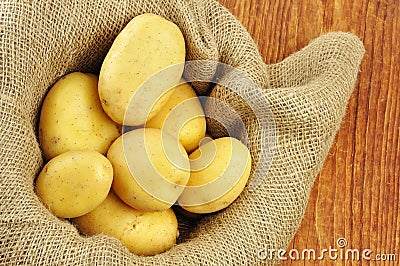 Raw potatoes in jute sack Stock Photo