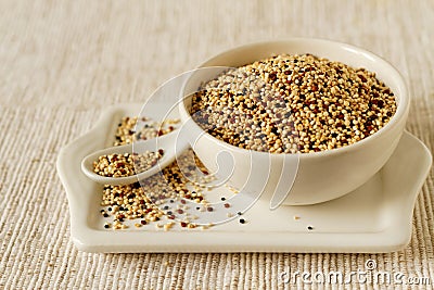 Raw quinoa in a bowl Stock Photo