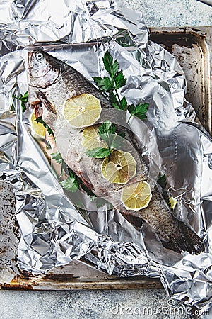 Raw rainbow trout in foil Stock Photo