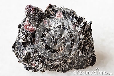 Raw red Garnet crystals in Biotite rock on white Stock Photo