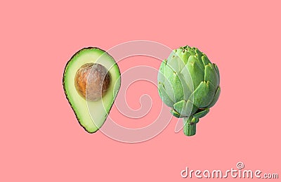 Raw ripe halved avocado with pit artichoke isolated on pink background. Creative food poster Stock Photo