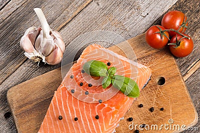 Raw salmon fillet with herbs Stock Photo