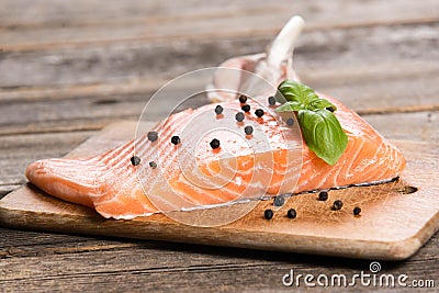 Raw salmon fillet with herbs Stock Photo