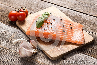 Raw salmon fillet with herbs Stock Photo