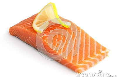 Raw salmon fillet on white. Lemon slice Stock Photo