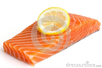 Raw salmon fillet on white. Lemon slice Stock Photo