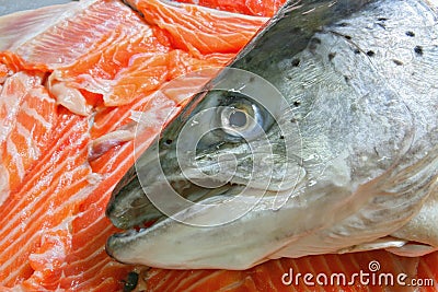 Raw Salmon Head on sliced salmon fillet Stock Photo
