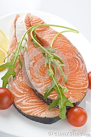 Raw salmon steak with herbs Stock Photo