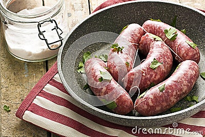 Raw Sausages in a Pan Stock Photo