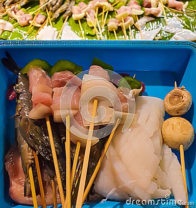 Raw Seafood on a plate taken for grilling in South East Asia. Balinese seafood from a restaurant Stock Photo