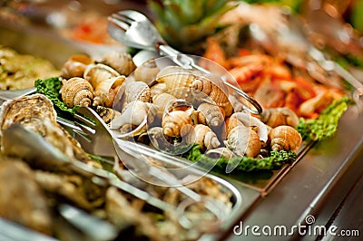 Raw seashells on buffet Stock Photo