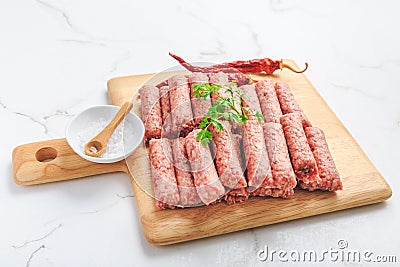 Raw serbian cevapi or cevapcici sausages ready for BBQ Stock Photo