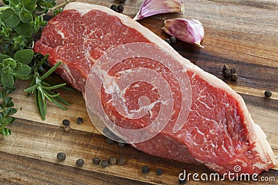 Raw Sirloin Steak with Herbs Stock Photo
