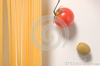 Raw spaghetti tomato and olive Stock Photo