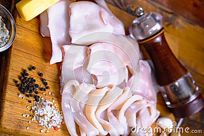 Raw squid composition on a wooden background Stock Photo