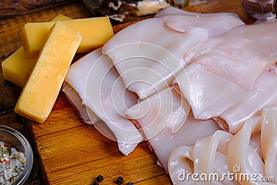 Raw squid composition on a wooden background Stock Photo