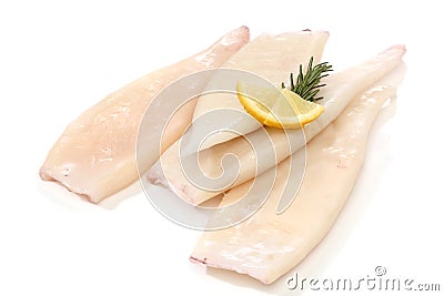 Raw squid tubes with lemon Stock Photo