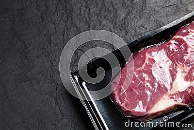 Raw steak in an airtight packaging Stock Photo