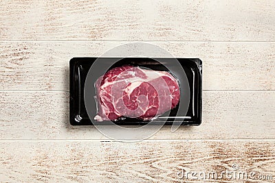 Raw steak in an airtight packaging Stock Photo