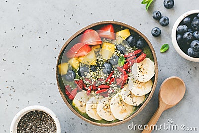 Raw superfood smoothie in coconut bowl Stock Photo