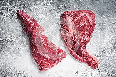Raw tri tip beef steak on kitchen table. White background. Top view Stock Photo