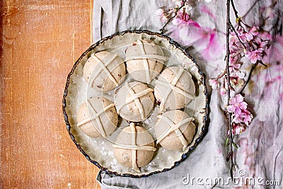 Raw unbaked homemade Easter traditional hot cross buns Stock Photo