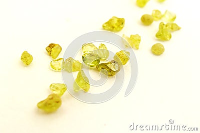 Raw uncut Peridot gem stones, white background Stock Photo