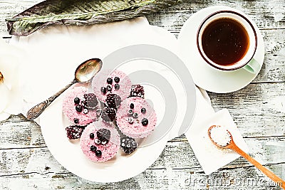 Raw vegan berry cheesecake with coconut, portioned Stock Photo