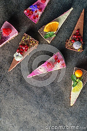 Raw vegan cakes with fruit and seeds, decorated with flower, product photography for patisserie Stock Photo