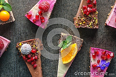 Raw vegan cakes with fruit and seeds, decorated with flower, product photography for patisserie Stock Photo