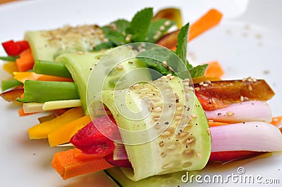 Raw , vegan meal with cucumber, pepper, onion and carrot Stock Photo