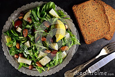 Spinach and Avocado Salad with Arugula, Pear, and Almonds Stock Photo