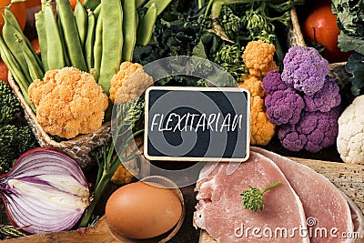 Raw vegetables, eggs and meat and text flexitarian Stock Photo