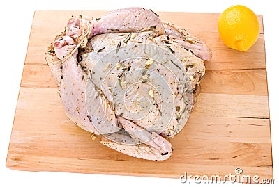 Raw whole chicken on a cutting board Stock Photo