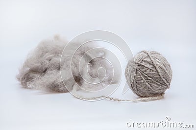 Raw wool yarn coiled into a ball Stock Photo